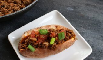 Taco stuffed sweet potatoes combine your favorite taco toppings with a nutritious sweet potato as a healthy base! Make this meal even quicker by cooking the sweet potatoes ahead of time. When it comes to weekly meal planning, we almost always have a taco-esc themed dinner night. So, whether that’s oven baked tacos, taco salads, or taco stuffed sweet potatoes, I’m bringing out the lean Ground Beef, some taco seasoning, and lots of cheese. Because the boys will demand cheese melted on a mini-tortilla when they realize it’s taco night! If you haven’t already guessed it, these taco stuffed sweet potatoes were thoroughly enjoyed by Ted and I. The boys? Eh. Like I said, they wanted cheese melted on a tortilla [in the microwave--- so gourmet!]. Anthony had some of the beef and a few bites of my sweet potato. Joey? He definitely had his fair share of melted cheese. That doesn’t mean your two or three-year-old won’t like taco stuffed sweet potatoes. I’m just giving you a heads-up to have some tortillas on hand for those that want carbs from a tortilla vs. a sweet potato. Can you blame them?!