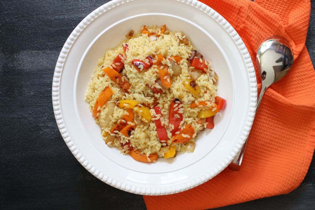 Orzo salad with bell peppers and garlic dressing is the perfect side dish for any summer BBQ or weeknight meal. Fresh bell peppers and a store bought dressing pack a punch of flavor!