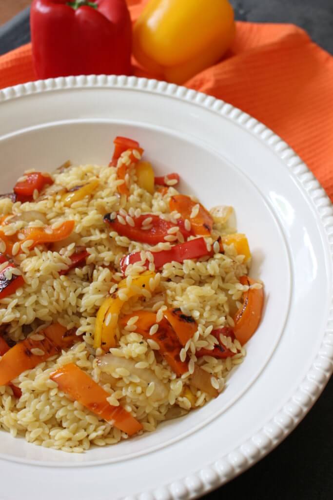 Orzo salad with bell peppers and garlic dressing is the perfect side dish for any summer BBQ or weeknight meal. Fresh bell peppers and a store bought dressing pack a punch of flavor!