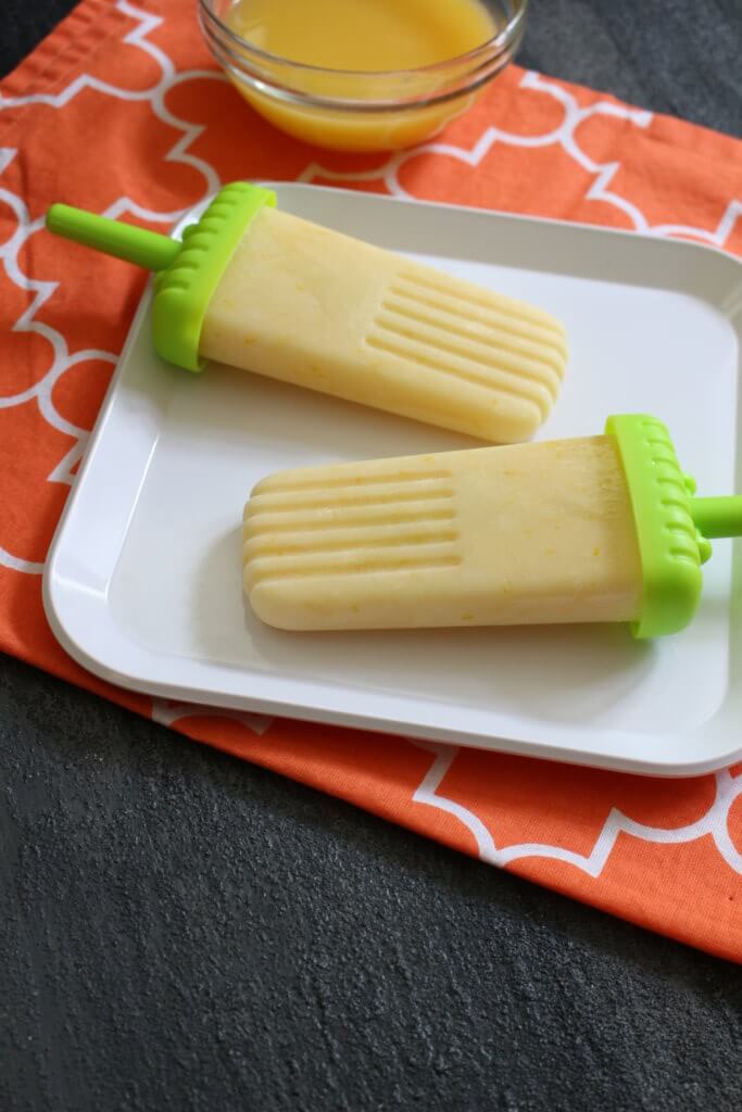 Cool-off during the summer months with these creamy Orange Julius Popsicles. Made with fresh Florida Orange Juice and protein-packed Greek yogurt, they are sure to satisfy! 