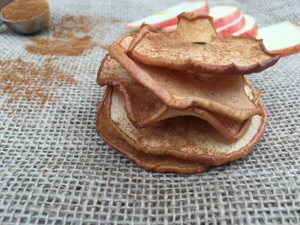 IMG_4609 - Mom to Mom Nutrition Baked apple chips make a nutritious and crunchy snack. All you need is two-ingredients, then slice, sprinkle with cinnamon, and bake!