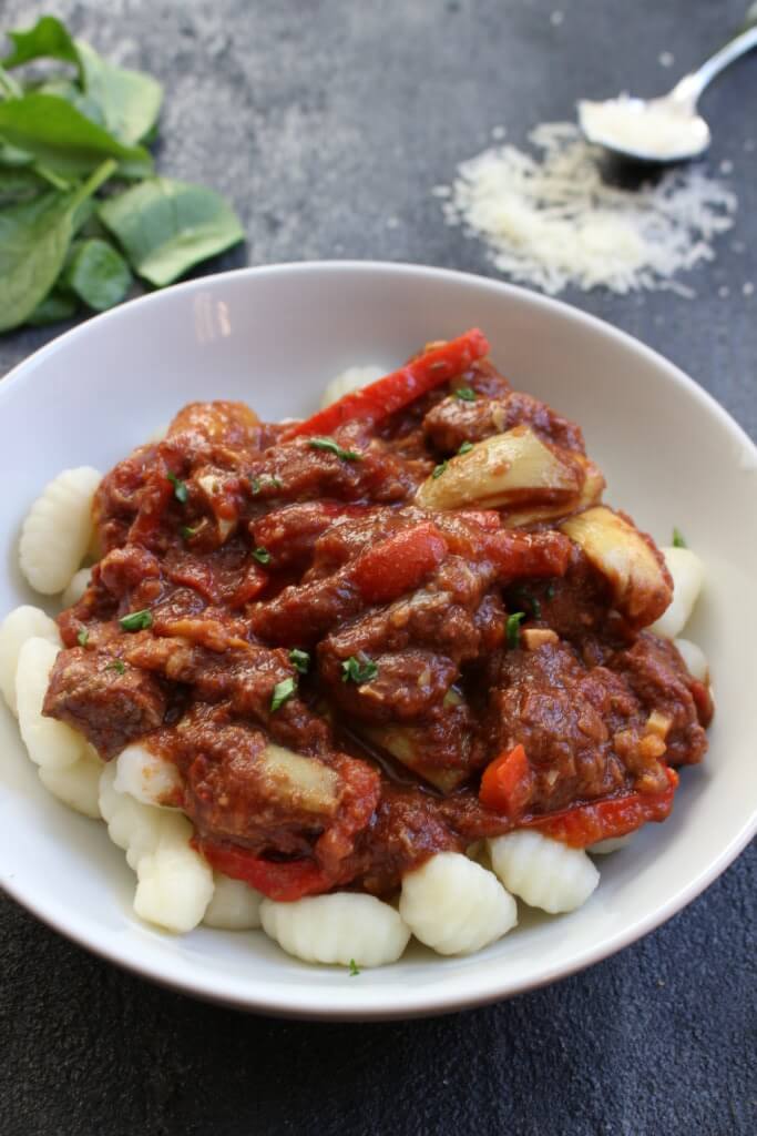 A simple rustic slow cooker Mediterranean beef recipe which includes Mediterranean flavors like basil and oregano, and tender beef that will fall apart in your mouth!