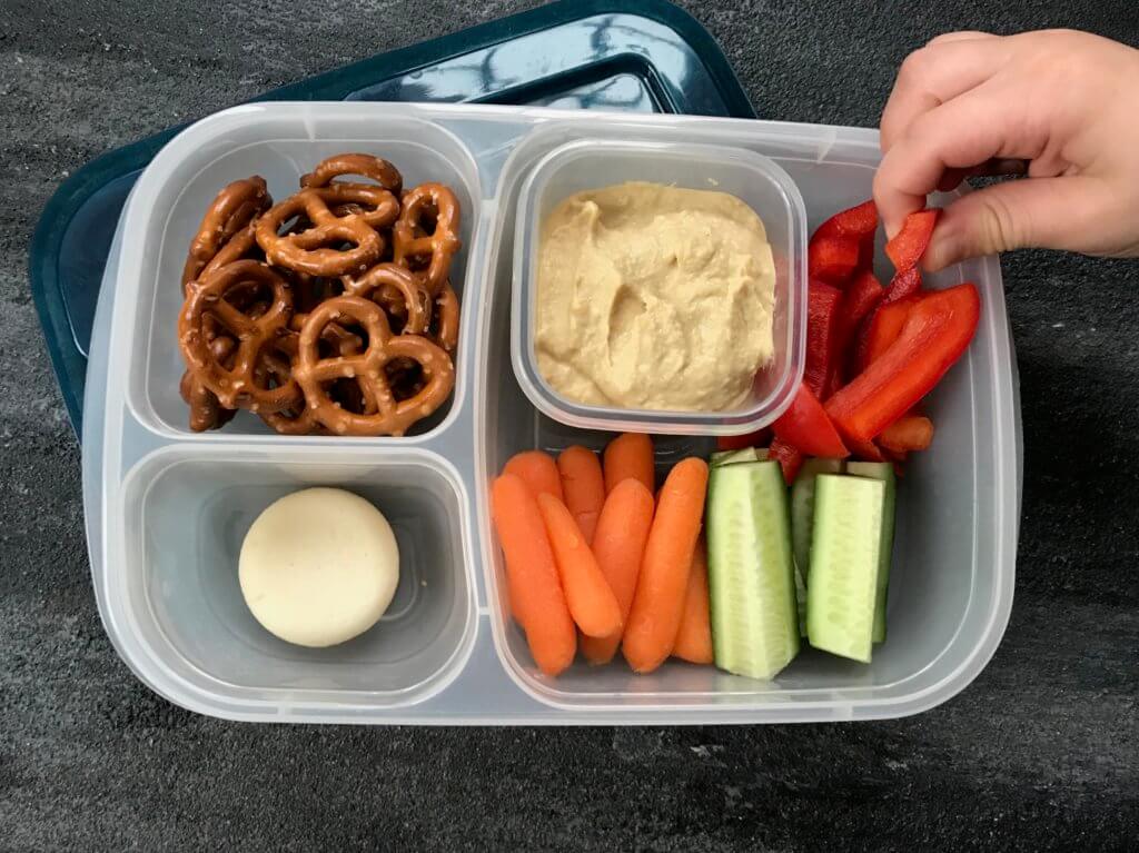 Pack your favorite flavored hummus + crunchy veggies for a healthy school hummus lunchbox.