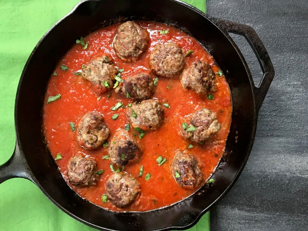 A classic meatball recipe gets a flavor-punch with extra Parmesan cheese in these easy baked Parmesan meatballs. 
