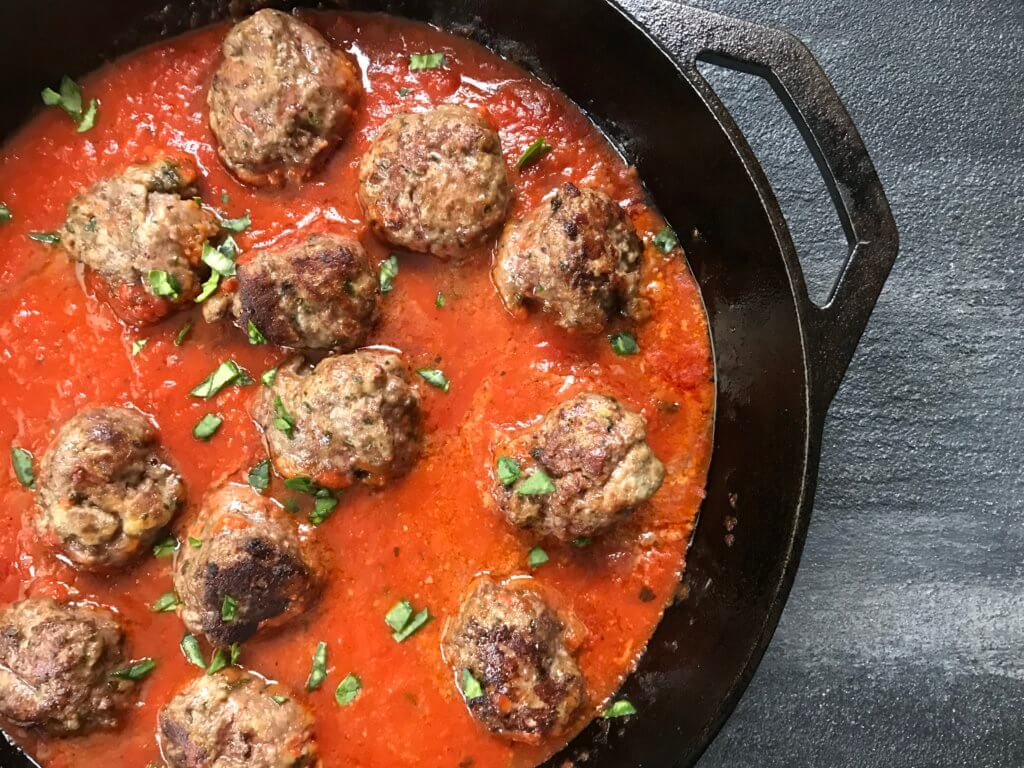 A classic meatball recipe gets a flavor-punch with extra Parmesan cheese in these easy baked Parmesan meatballs.