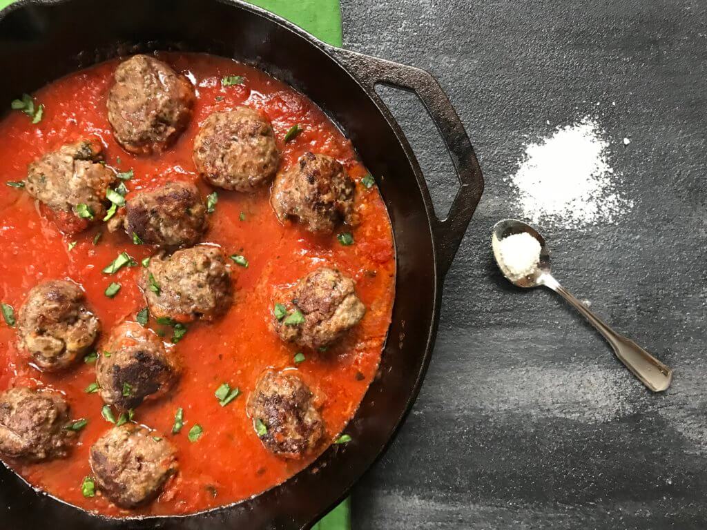 A classic meatball recipe gets a flavor-punch with extra Parmesan cheese in these easy baked Parmesan meatballs.