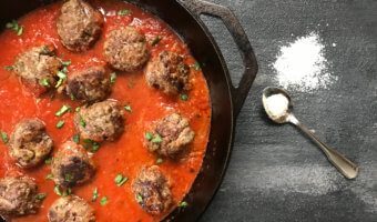 A classic meatball recipe gets a flavor-punch with extra Parmesan cheese in these easy baked Parmesan meatballs.