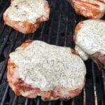 Grilled pork chops with lemony dill sauce make a delicious main for any BBQ or outdoor gathering. Fresh, fast, and simple, the sauce it what makes the pork extra moist!