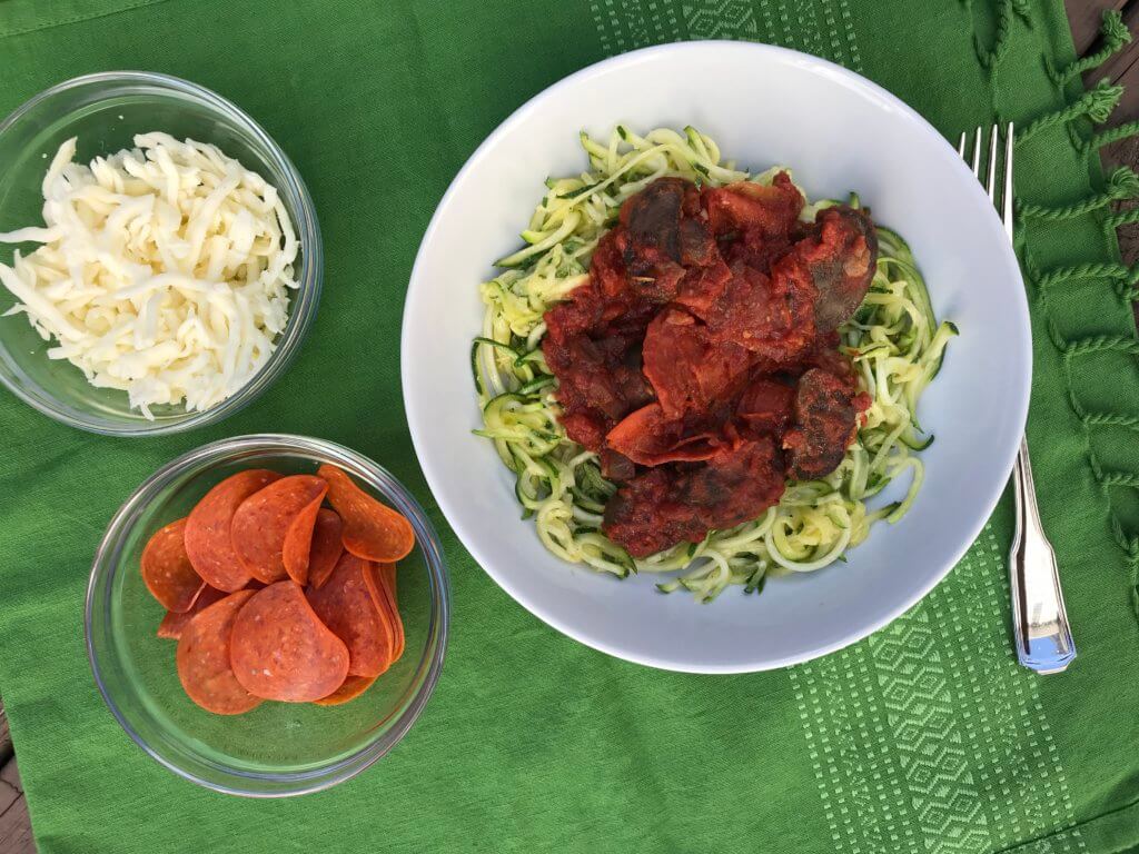 Pizza zoodles are a pizza-inspired meal much lighter than the traditional flour crust. Filled with lots of veggies and a few store-bought shortcuts, this is one dinner the whole family will love.