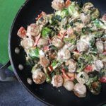 Cheesy Italian Chicken Skillet is the perfect one-pan dinner for any busy weeknight. Packed with vegetables and a simple garlic cheese sauce, dinner is ready in less than 20 minutes.