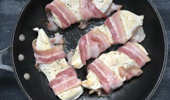 These Bacon Ranch Chicken Breasts are wrapped in bacon, seasoned with a dry ranch seasoning, and smothered with shredded cheddar cheese for a simple weeknight dinner!