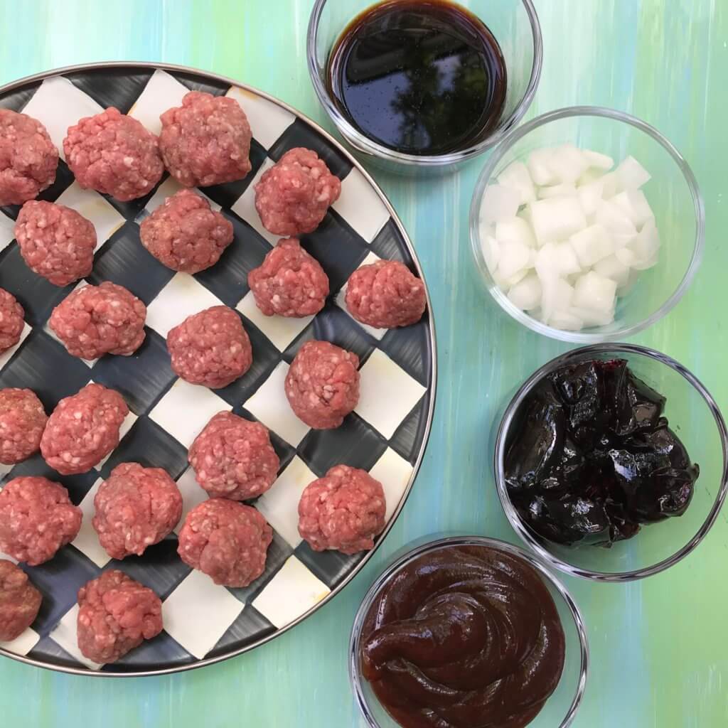 5 Ingredient Slow Cooker Meatballs are simple, saucy, and the ideal kid-friendly dinner. Once you have the meatballs rolled, just let your slow cooker do the work and enjoy in 4 hours! 