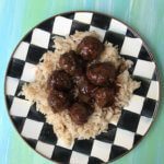 5 Ingredient Slow Cooker Meatballs are simple, saucy, and the ideal kid-friendly dinner. Once you have the meatballs rolled, just let your slow cooker do the work and enjoy in 4 hours! 