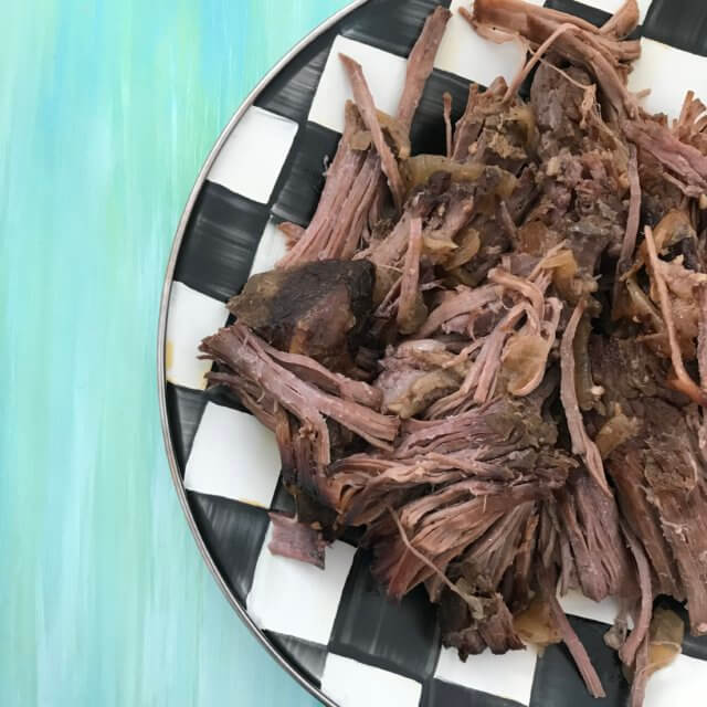 Slow Cooker Shredded Beef is the ideal cook once dine twice meal. This basic recipe can be eaten as-is, or used for multiple recipe ideas.