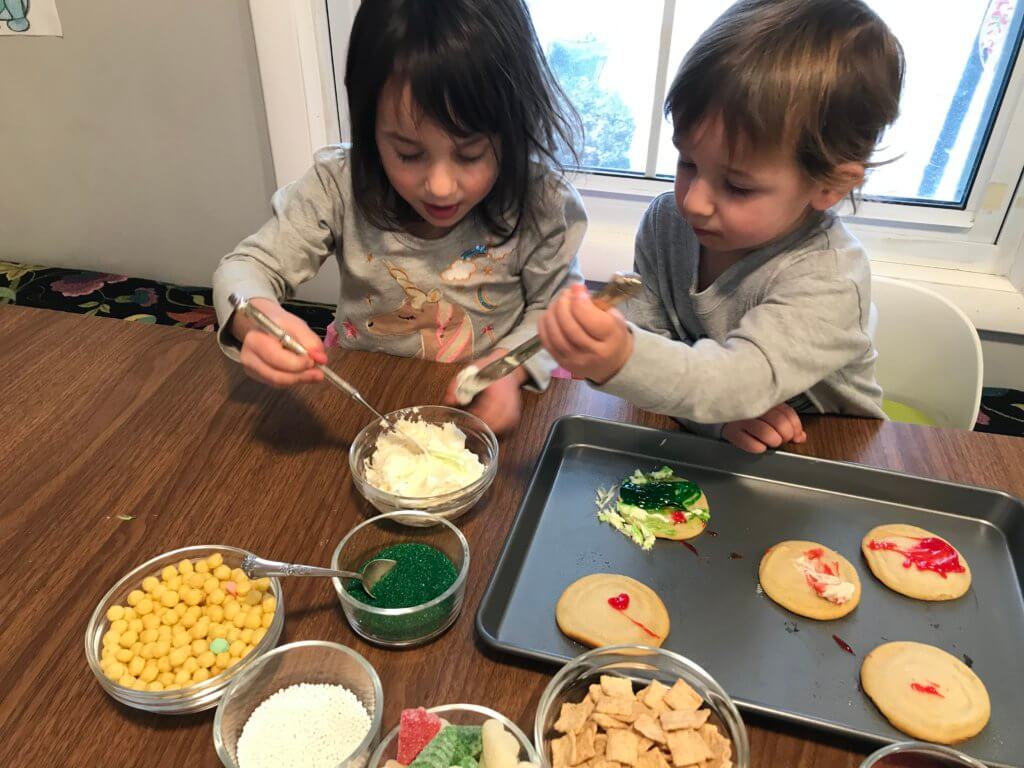 A Christmas Cookie Decorating Station is a simple, fun holiday-inspired activity for kids of all ages. Assemble the station based on your family's preferences for cookies, frosting, and toppings!&nbsp;