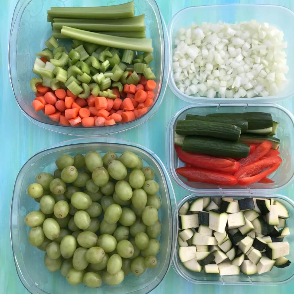 eat-more-fruits-veggies-5 - Mom to Mom Nutrition Fruits and veggies chopped, sliced, and diced in clear containers.