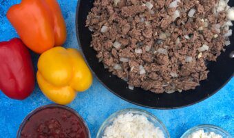 Greek Stuffed Bell Peppers are a Mediterranean twist on a family favorite weeknight classic. Made with lean Ground Beef and other kitchen staples like canned tomatoes, dried spices, and feta cheese.