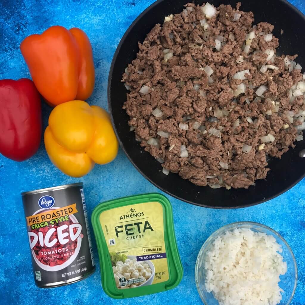 IMG_8453 - Mom to Mom Nutrition Greek Stuffed Bell Peppers are a Mediterranean twist on a family favorite weeknight classic. Made with lean Ground Beef and other kitchen staples like canned tomatoes, dried spices, and feta cheese.