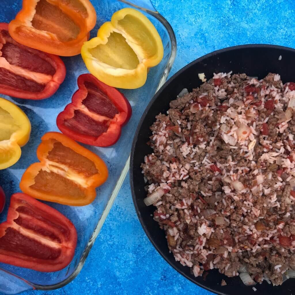 IMG_8456 - Mom to Mom Nutrition Greek Stuffed Bell Peppers are a Mediterranean twist on a family favorite weeknight classic. Made with lean Ground Beef and other kitchen staples like canned tomatoes, dried spices, and feta cheese.