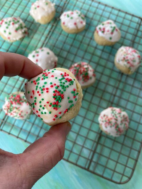 IMG_5987 - Mom to Mom Nutrition Italian Christmas cookies are soft, poofy sugar cookies topped with a sweet almond glaze and colorful sprinkles.