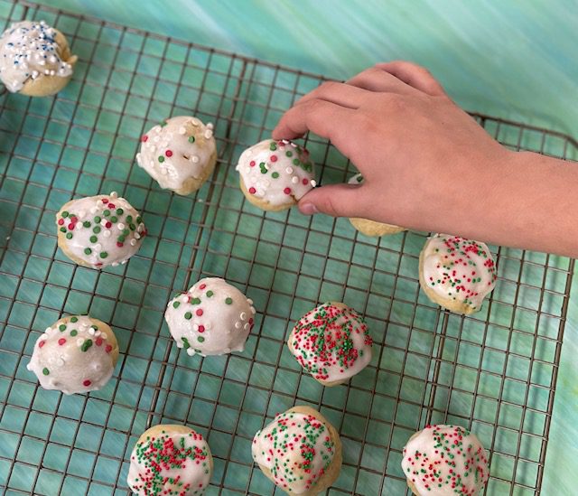 IMG_5989 - Mom to Mom Nutrition Italian Christmas cookies are soft, poofy sugar cookies topped with a sweet almond glaze and colorful sprinkles.