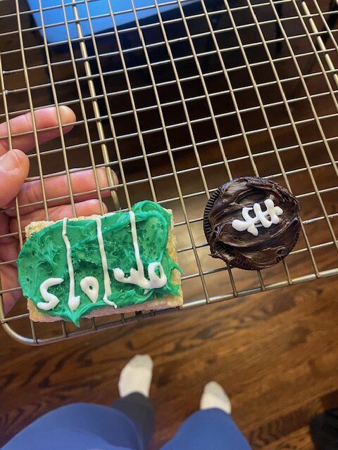 Score a touchdown with these easy football-themed treats- Oreos, brownie bites, and Rice Krispie squares decorated with frosting to look like footballs and a football field.