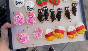 Halloween sugar cookie decorating made easy! Fun, messy, and memorable family night with kids using store-bought frosting and spooky cookie cutters.