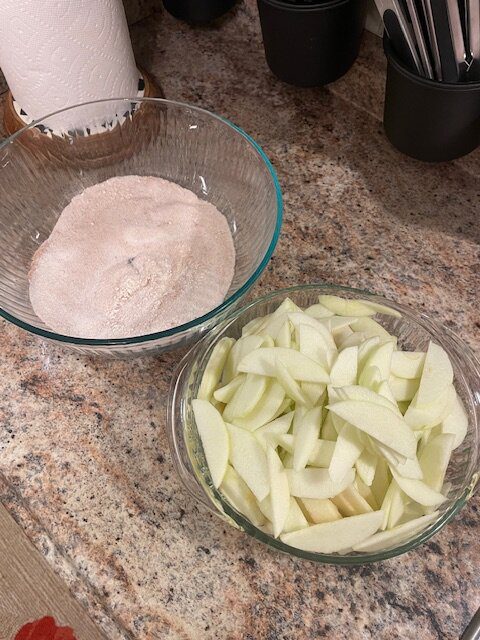 IMG_1584 - Mom to Mom Nutrition A cozy sheet pan apple pie made with premade pie crusts, cinnamon-spiced apples, and a brown sugar crumble. Perfect for holidays, potlucks, and feeding a crowd—without the fuss.
