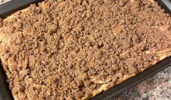 A cozy sheet pan apple pie made with premade pie crusts, cinnamon-spiced apples, and a brown sugar crumble. Perfect for holidays, potlucks, and feeding a crowd—without the fuss.