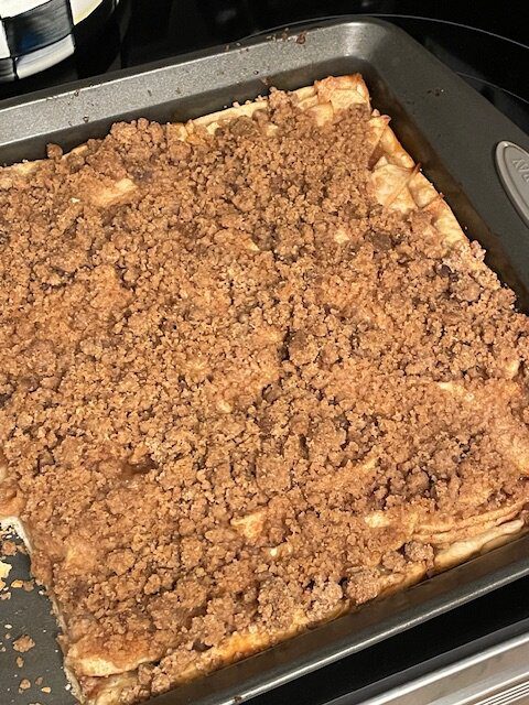 IMG_1604 (1) - Mom to Mom Nutrition A cozy sheet pan apple pie made with premade pie crusts, cinnamon-spiced apples, and a brown sugar crumble. Perfect for holidays, potlucks, and feeding a crowd—without the fuss.