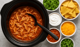 Make dinner easier with this slow cooker salsa chicken recipe! Turn one simple recipe into 3 easy family meals—taco bowls, quesadillas, and nachos. Perfect for busy moms and sports nights.